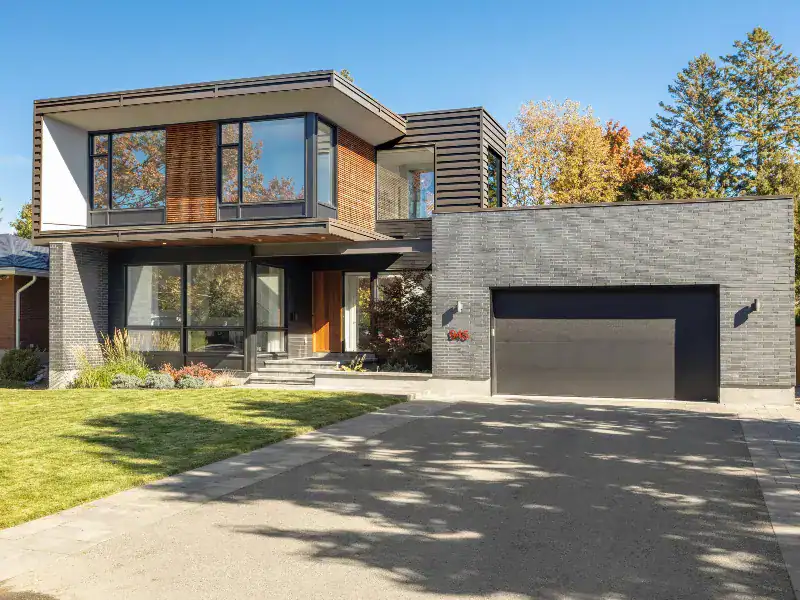 Modern home with a black energy-efficient garage door